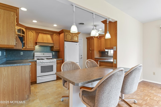 3 Shaw Ct, Toms River, NJ 08757 - kitchen with white appliances, custom range hood, a breakfast bar area, decorative backsplash, and recessed lighting