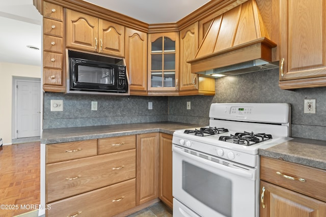 3 Shaw Ct, Toms River, NJ 08757 - kitchen featuring white range with gas cooktop, custom exhaust hood, black microwave, glass insert cabinets, and decorative backsplash