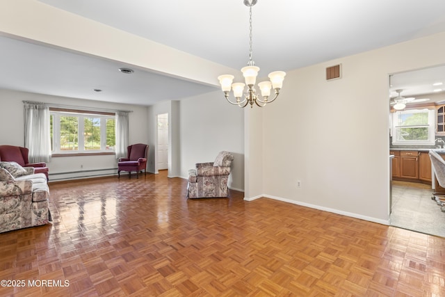 3 Shaw Ct, Toms River, NJ 08757 - living area featuring a baseboard heating unit and a chandelier