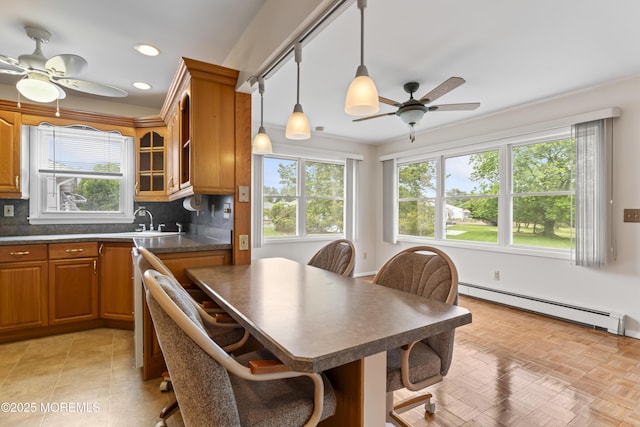 3 Shaw Ct, Toms River, NJ 08757 - kitchen featuring ceiling fan, a baseboard heating unit, dark countertops, plenty of natural light, and recessed lighting