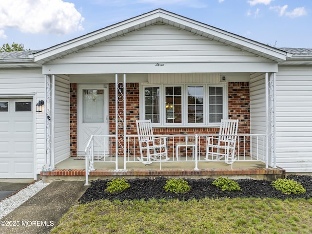 3 Shaw Ct, Toms River, NJ 08757 - view of front of home featuring a porch, brick siding, a garage, and a shingled roof