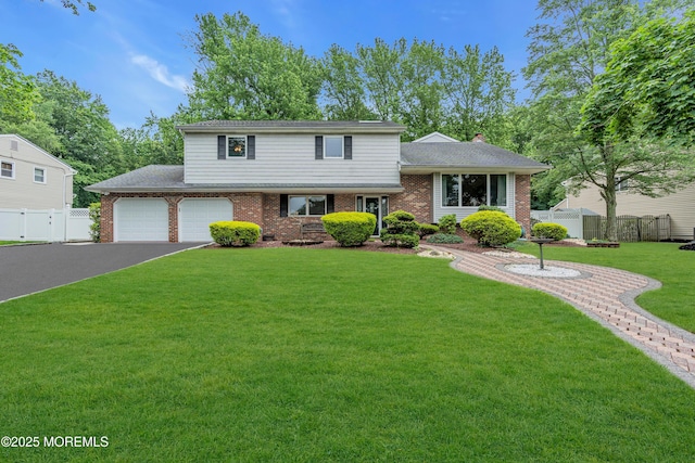 25 Canadian Woods Rd, Marlboro, NJ 07746 - tri-level home with brick siding, driveway, and a garage