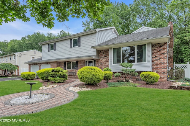 25 Canadian Woods Rd, Marlboro, NJ 07746 - split level home with a chimney and brick siding