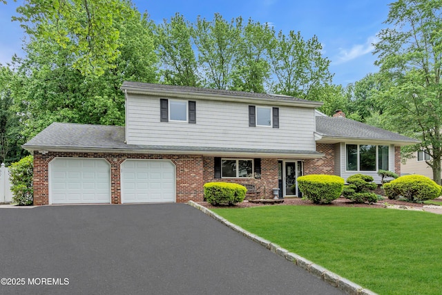 25 Canadian Woods Rd, Marlboro, NJ 07746 - view of front of home with driveway, a garage, a front yard, brick siding, and a chimney