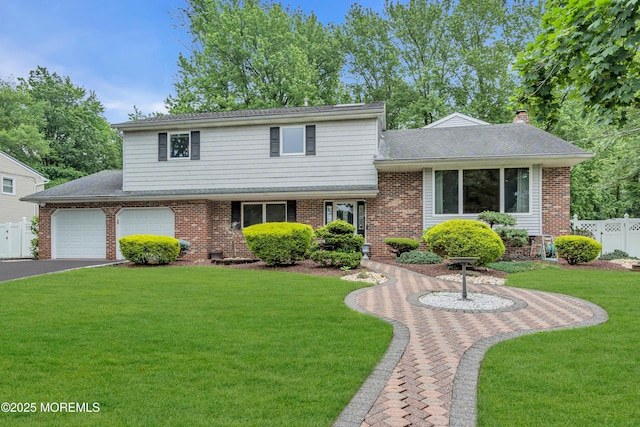 25 Canadian Woods Rd, Marlboro, NJ 07746 - tri-level home with driveway, brick siding, and roof with shingles