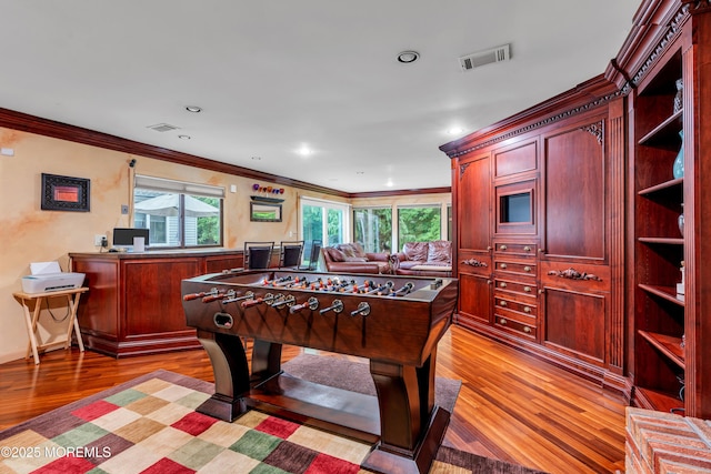 25 Canadian Woods Rd, Marlboro, NJ 07746 - game room with ornamental molding, light wood-style floors, and recessed lighting