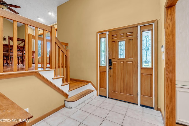 25 Canadian Woods Rd, Marlboro, NJ 07746 - foyer featuring stairway, light tile patterned floors, and ceiling fan