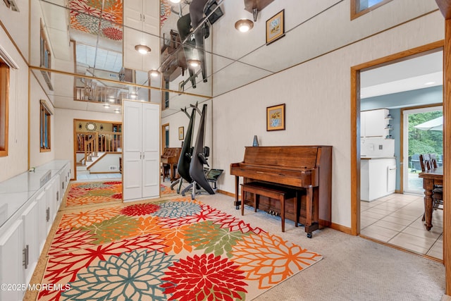 25 Canadian Woods Rd, Marlboro, NJ 07746 - living room featuring light carpet, stairs, and a towering ceiling