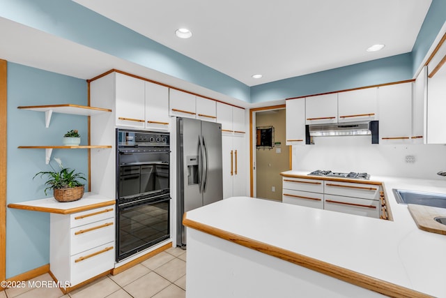 25 Canadian Woods Rd, Marlboro, NJ 07746 - kitchen with stainless steel fridge, under cabinet range hood, light countertops, white cabinets, and recessed lighting