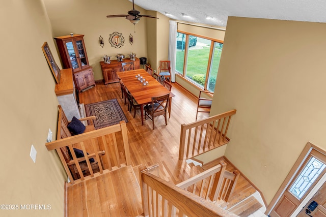 25 Canadian Woods Rd, Marlboro, NJ 07746 - dining area with healthy amount of natural light, wood finished floors, ceiling fan, and stairs