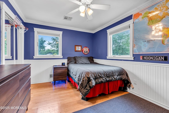 25 Canadian Woods Rd, Marlboro, NJ 07746 - bedroom featuring wainscoting, ornamental molding, light wood-style flooring, and ceiling fan