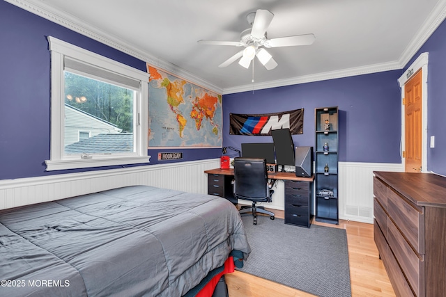 25 Canadian Woods Rd, Marlboro, NJ 07746 - bedroom with wainscoting, crown molding, light wood-style flooring, an office area, and a ceiling fan