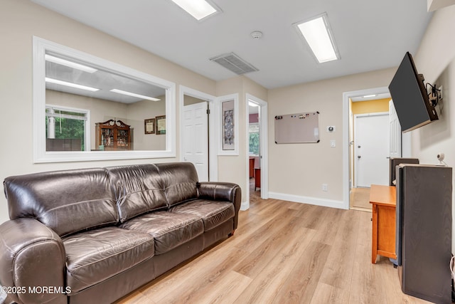 25 Canadian Woods Rd, Marlboro, NJ 07746 - living room with light wood finished floors and baseboards