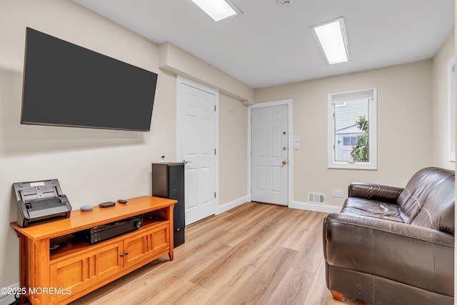 25 Canadian Woods Rd, Marlboro, NJ 07746 - living area featuring light wood-style floors and baseboards