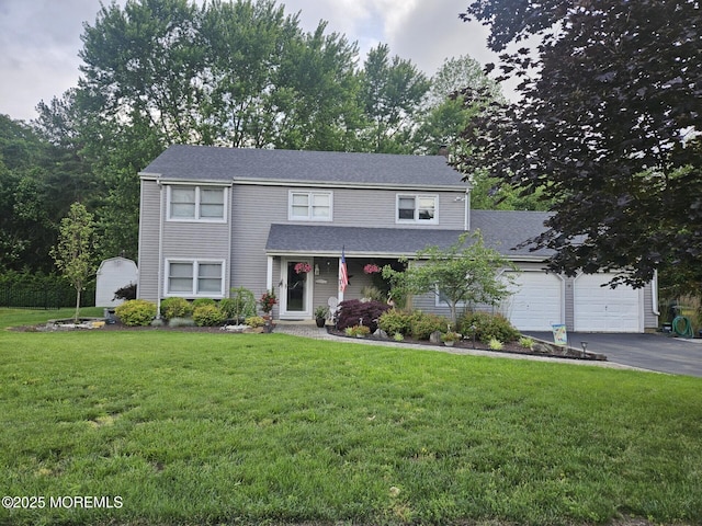 5 Hampton Dr, Jackson, NJ 08527 - traditional-style home with asphalt driveway, a front yard, a garage, a shingled roof, and a shed