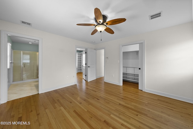 58 Pinehurst Rd, Brick, NJ 08723 - unfurnished bedroom featuring a spacious closet, light wood-type flooring, a closet, ensuite bathroom, and a ceiling fan