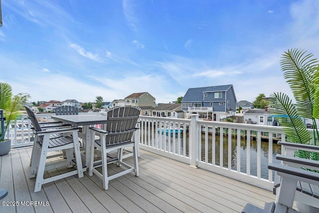 917 Jane Dr, Beach Haven West, NJ 08050 - wooden deck with outdoor dining space, a water view, and a residential view