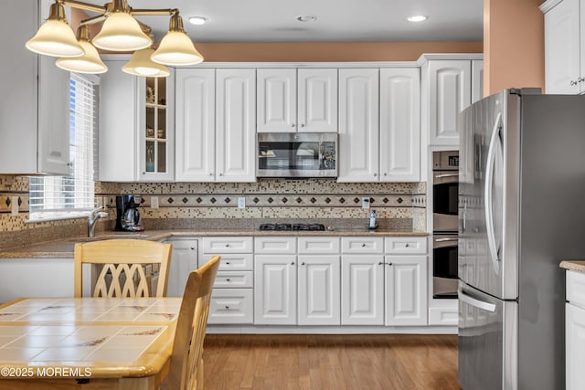 42 Eagleswood Dr, Waretown, NJ 08758 - kitchen with stainless steel appliances, white cabinetry, glass insert cabinets, tasteful backsplash, and recessed lighting