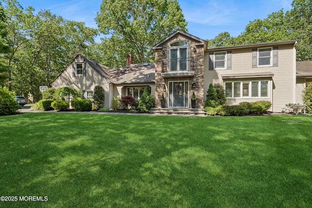 4040 Herbertsville Rd, Wall, NJ 08724 - traditional-style house featuring a front yard and a balcony