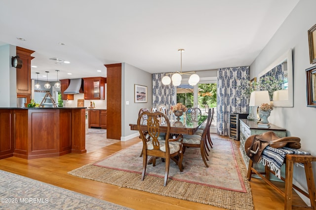 4040 Herbertsville Rd, Wall, NJ 08724 - dining area with light wood finished floors, recessed lighting, and a chandelier