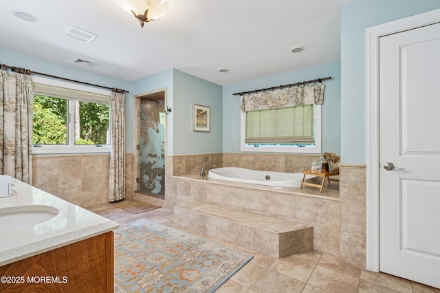 4040 Herbertsville Rd, Wall, NJ 08724 - bathroom with a bath, a shower stall, double vanity, tile patterned flooring, and wainscoting