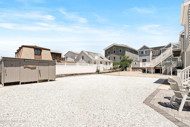 3 Newark Ave, Lavallette, NJ 08735 - view of dirt / gravel driveway featuring a residential view and stairs