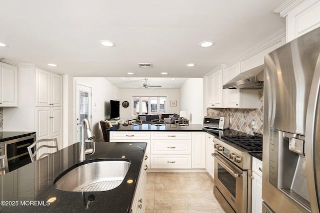 3 Newark Ave, Lavallette, NJ 08735 - kitchen featuring appliances with stainless steel finishes, wine cooler, exhaust hood, ceiling fan, and a peninsula
