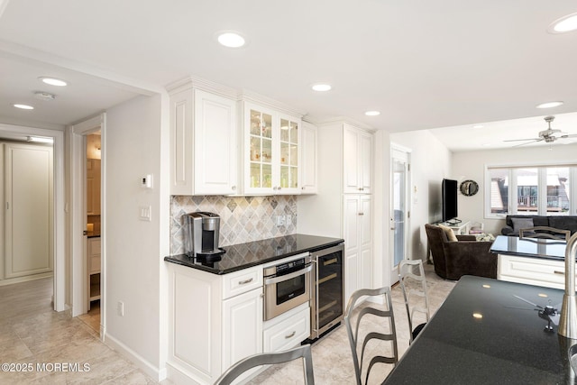 3 Newark Ave, Lavallette, NJ 08735 - kitchen featuring beverage cooler, open floor plan, recessed lighting, dark countertops, and decorative backsplash