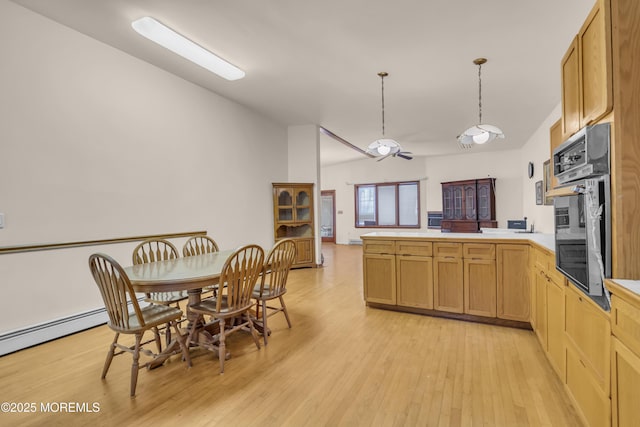 193 Ocean Blvd, Atlantic Highlands, NJ 07716 - kitchen featuring a peninsula, light wood-style flooring, stainless steel oven, light countertops, and hanging light fixtures
