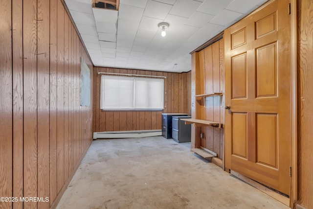193 Ocean Blvd, Atlantic Highlands, NJ 07716 - spare room with baseboard heating, wood walls, and concrete flooring