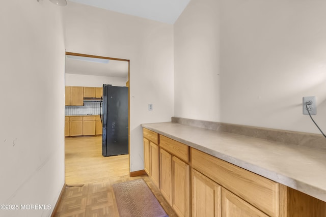 193 Ocean Blvd, Atlantic Highlands, NJ 07716 - kitchen with freestanding refrigerator, light wood-type flooring, tasteful backsplash, and light countertops