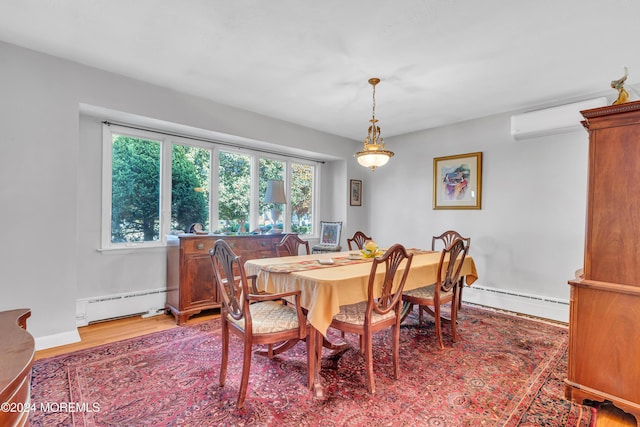 708 New York Blvd, Sea Girt, NJ 08750 - dining room with baseboard heating, an AC wall unit, and light wood finished floors