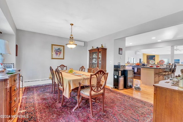 708 New York Blvd, Sea Girt, NJ 08750 - dining space with a baseboard radiator, light wood-style flooring, recessed lighting, and a wall unit AC