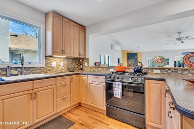 708 New York Blvd, Sea Girt, NJ 08750 - kitchen with gas stove, light brown cabinetry, and decorative backsplash