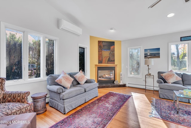 708 New York Blvd, Sea Girt, NJ 08750 - living room with a baseboard heating unit, an AC wall unit, a tile fireplace, wood finished floors, and recessed lighting