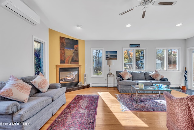 708 New York Blvd, Sea Girt, NJ 08750 - living room with baseboard heating, a wall unit AC, a ceiling fan, recessed lighting, and a glass covered fireplace