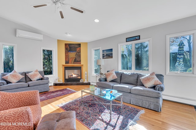 708 New York Blvd, Sea Girt, NJ 08750 - living room featuring a wall unit AC, healthy amount of natural light, a baseboard radiator, wood finished floors, and recessed lighting