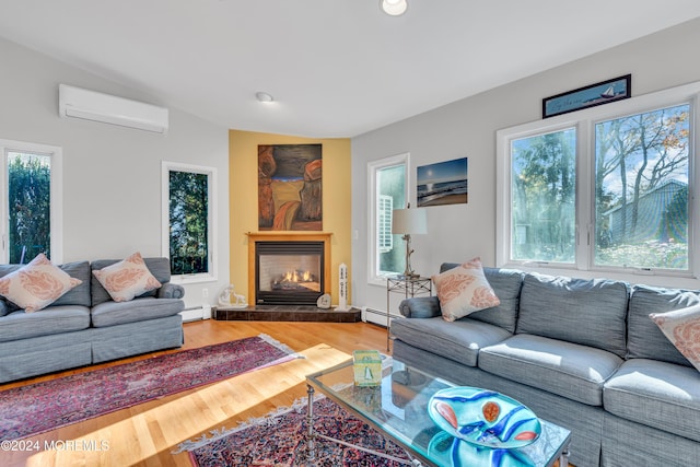 708 New York Blvd, Sea Girt, NJ 08750 - living area featuring an AC wall unit, baseboard heating, plenty of natural light, wood finished floors, and recessed lighting