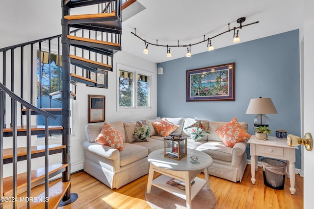 708 New York Blvd, Sea Girt, NJ 08750 - living room featuring wood finished floors, stairway, and track lighting
