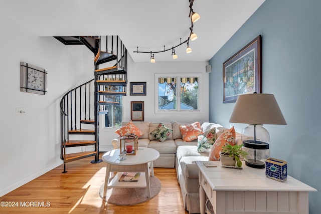 708 New York Blvd, Sea Girt, NJ 08750 - living room featuring stairs, light wood-style flooring, and track lighting