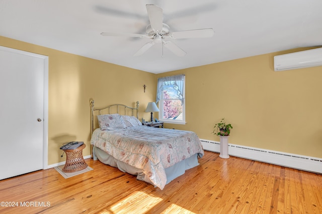 708 New York Blvd, Sea Girt, NJ 08750 - bedroom with a wall mounted air conditioner, a baseboard radiator, wood finished floors, and a ceiling fan