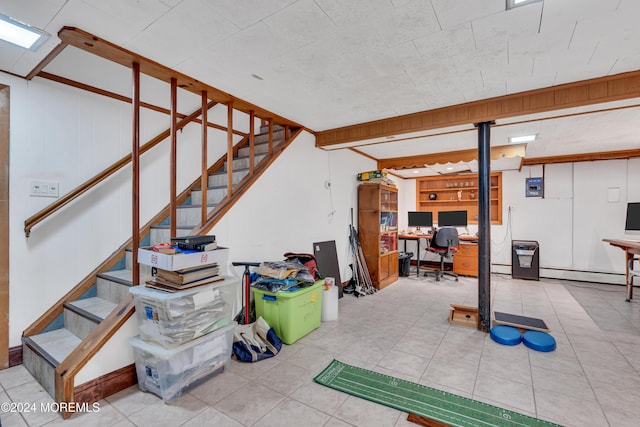 708 New York Blvd, Sea Girt, NJ 08750 - finished below grade area with an office area, stairway, baseboard heating, and tile patterned flooring