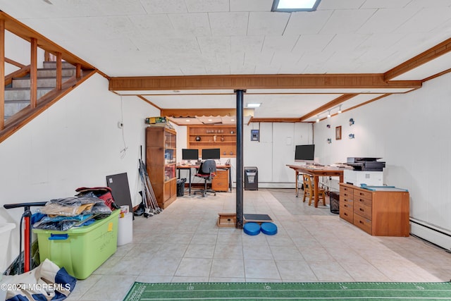 708 New York Blvd, Sea Girt, NJ 08750 - below grade area with a desk, light tile patterned floors, a baseboard heating unit, and a baseboard radiator