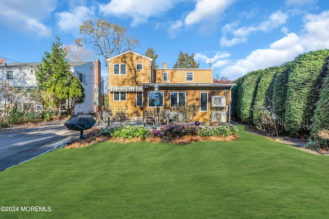 708 New York Blvd, Sea Girt, NJ 08750 - view of front of house featuring a front yard and a chimney