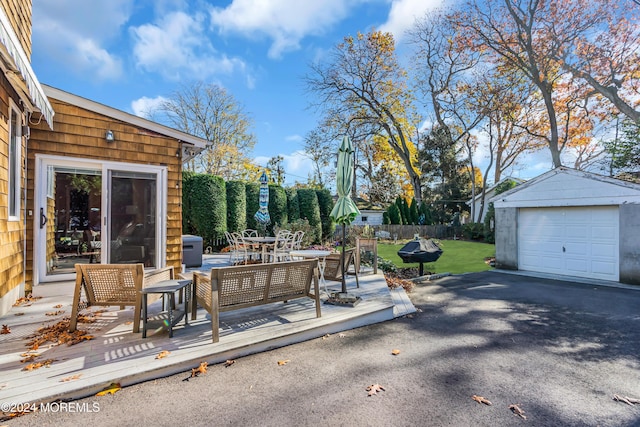 708 New York Blvd, Sea Girt, NJ 08750 - view of patio / terrace featuring a deck, an outdoor structure, a detached garage, driveway, and a grill