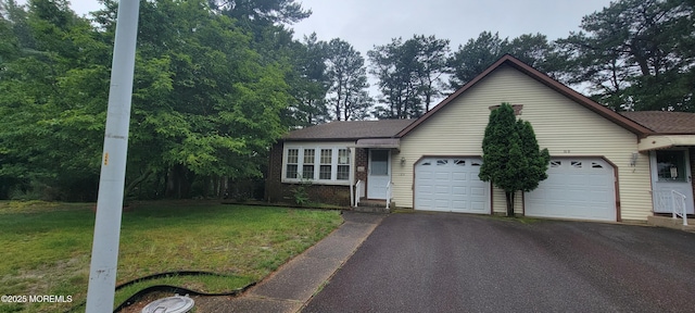 16 Ivy Ct Unit A, Whiting, NJ 08759 - ranch-style house featuring asphalt driveway, an attached garage, and a front yard