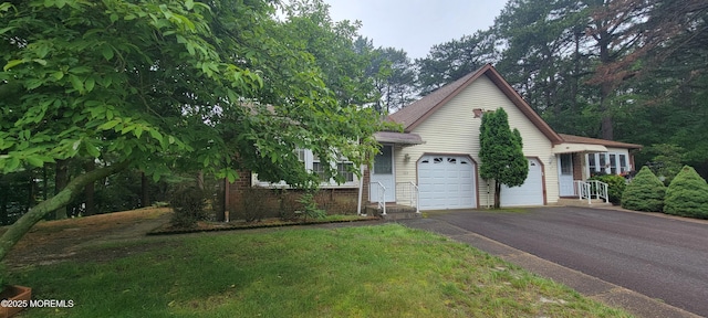 16 Ivy Ct Unit A, Whiting, NJ 08759 - view of front of property with driveway, a garage, and brick siding