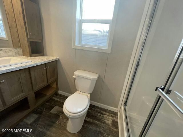 9 Mary Ann Ct, Hazlet, NJ 07734 - full bath featuring vanity, an enclosed shower, wood finished floors, and healthy amount of natural light
