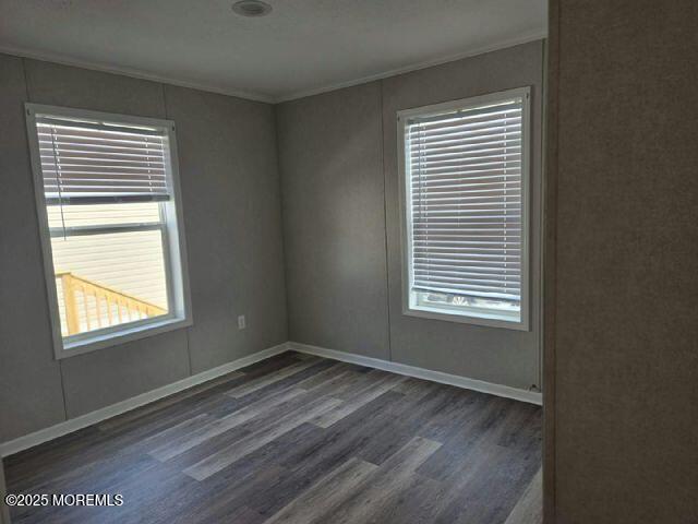 9 Mary Ann Ct, Hazlet, NJ 07734 - empty room featuring ornamental molding, wood finished floors, and plenty of natural light
