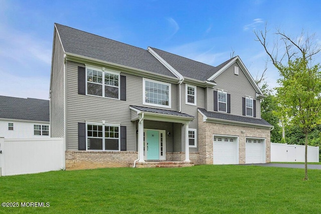 10 Willow Ave, Matawan, NJ 07747 - view of front facade featuring driveway, brick siding, an attached garage, a standing seam roof, and a shingled roof